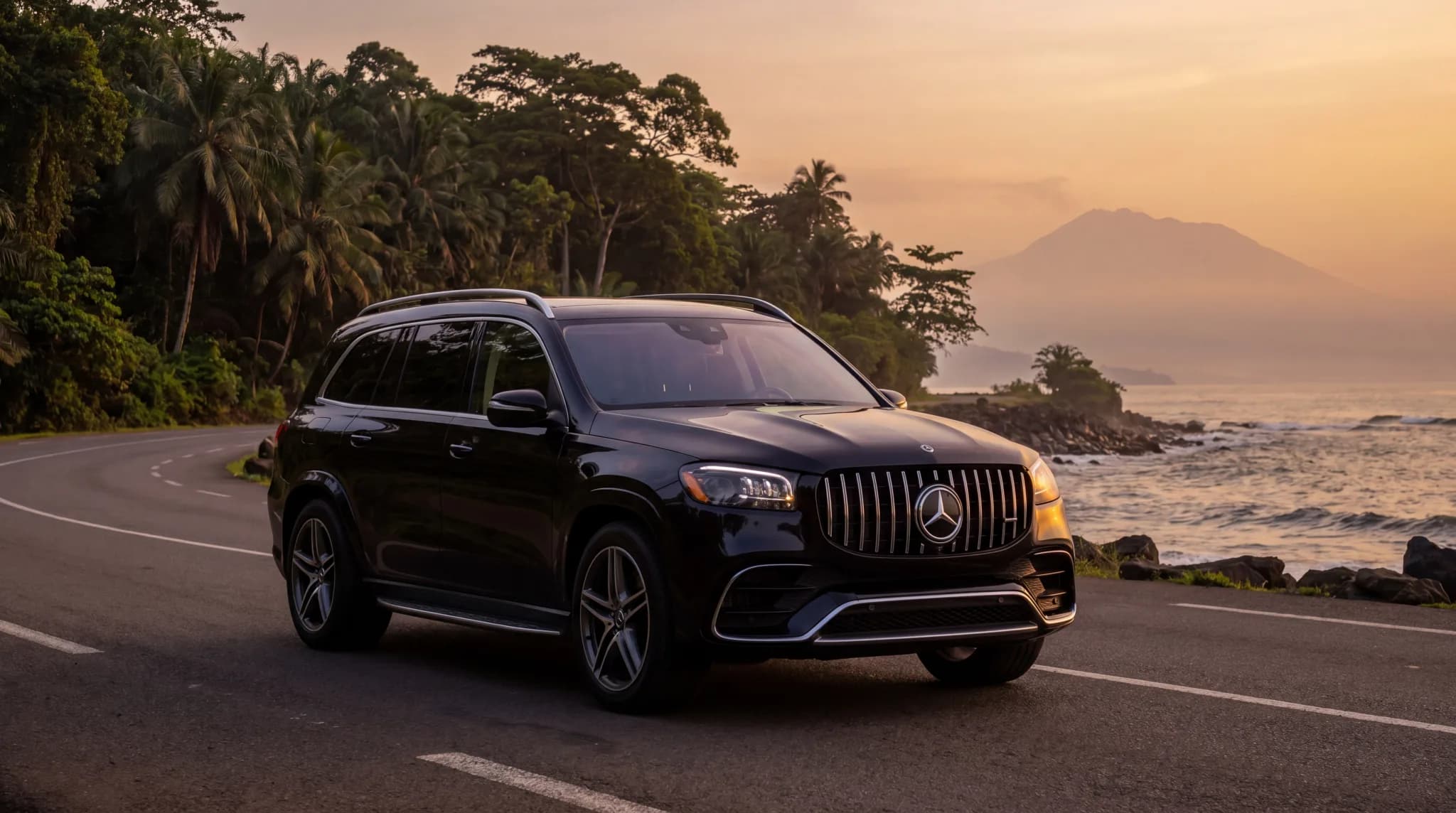 Black Mercedes-Benz GLS luxury SUV on a Cameroonian coastal road at golden hour